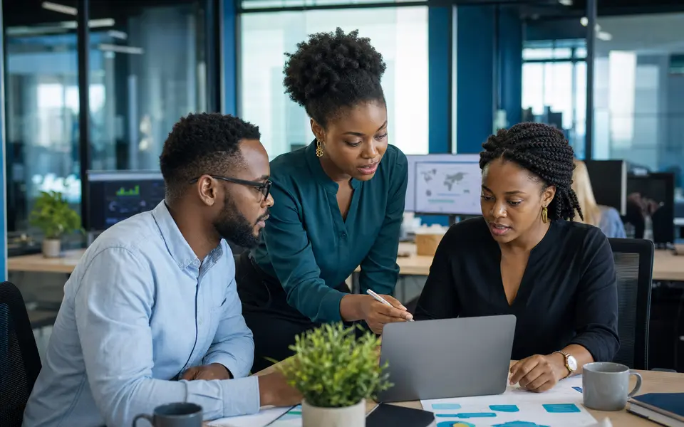 African business team reviewing customer and service operations together