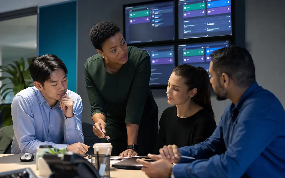 Diverse customer-facing team coordinating live channel handoffs